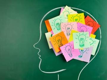 drawing of persons head with post it note ideas stuck to it